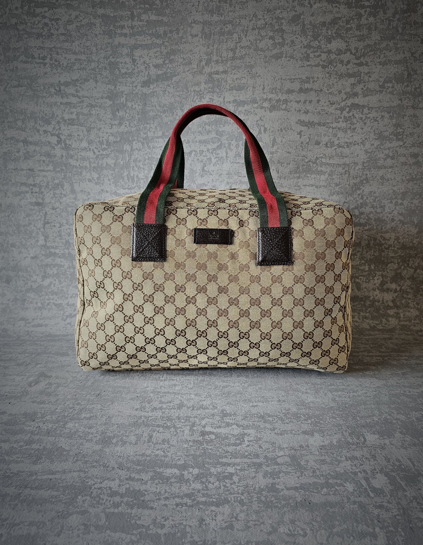 GUCCI GG Leather and webbing-trimmed Supreme Monogram Duffle Bag