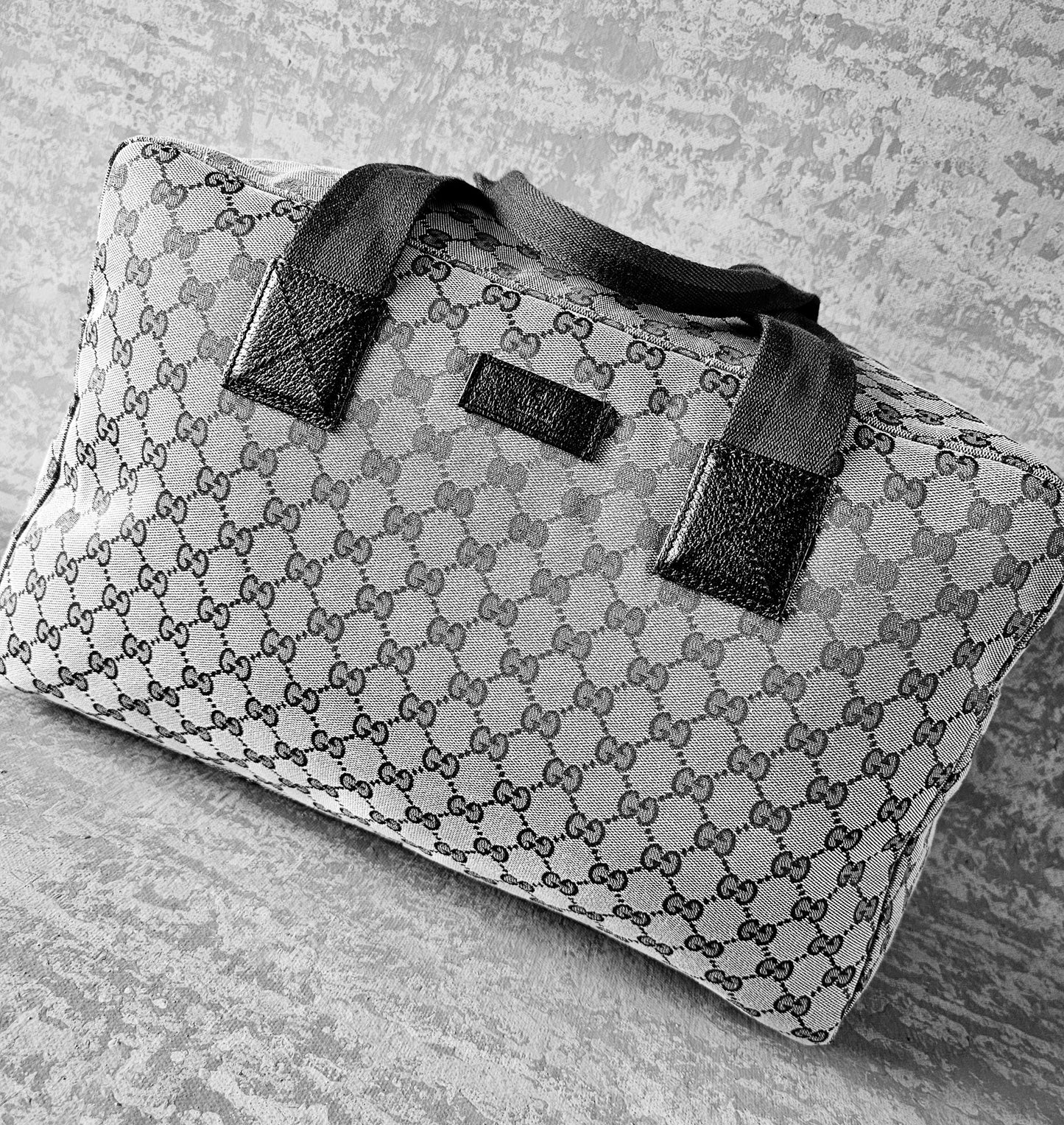 GUCCI GG Leather and webbing-trimmed Supreme Monogram Duffle Bag