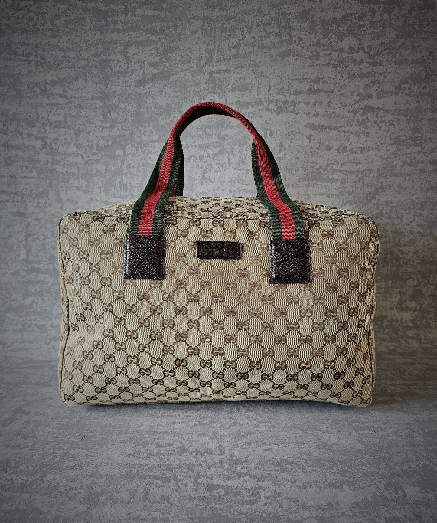 GUCCI GG Leather and webbing-trimmed Supreme Monogram Duffle Bag