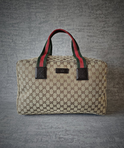 GUCCI GG Leather and webbing-trimmed Supreme Monogram Duffle Bag