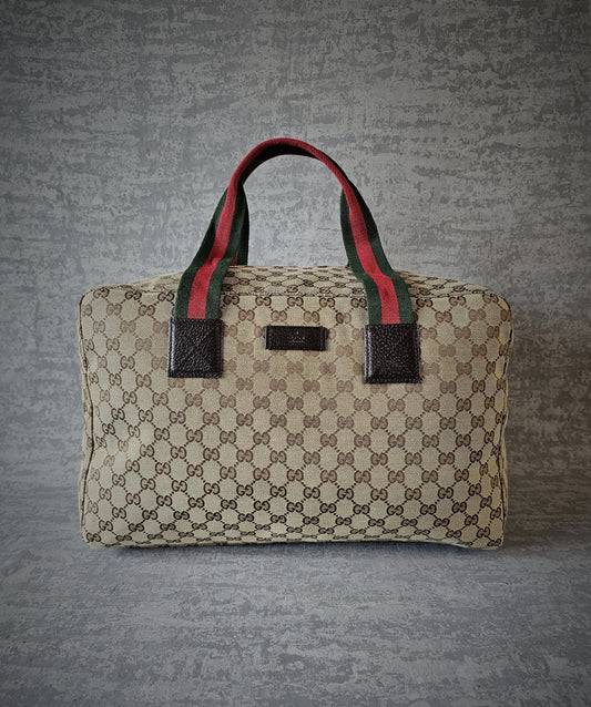 GUCCI GG Leather and webbing-trimmed Supreme Monogram Duffle Bag