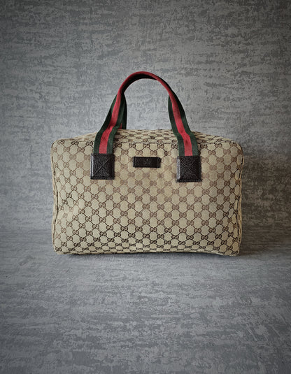 GUCCI GG Leather and webbing-trimmed Supreme Monogram Duffle Bag