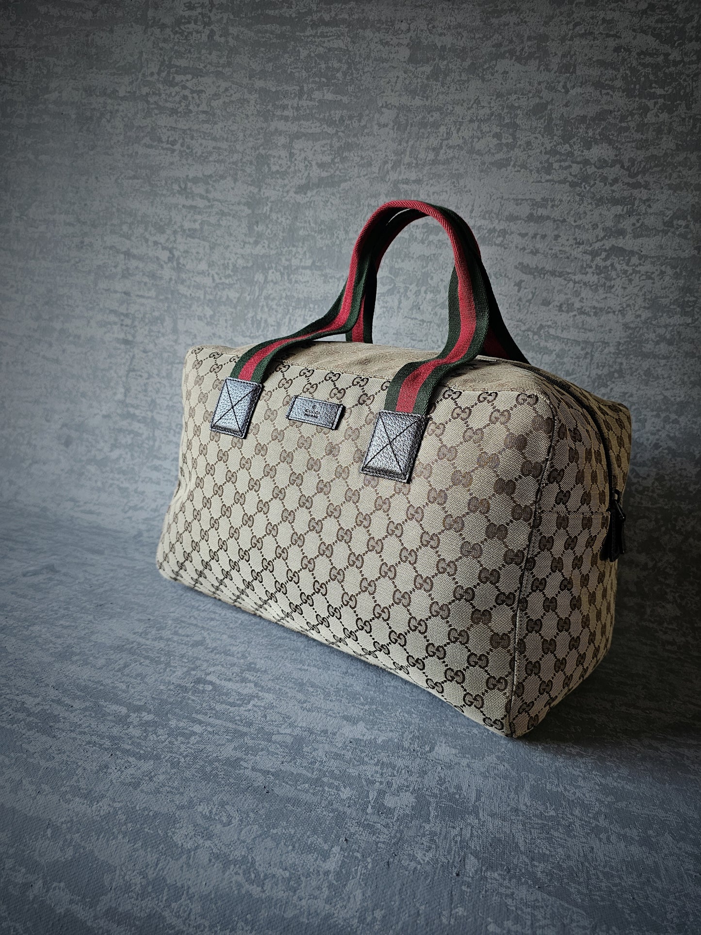 GUCCI GG Leather and webbing-trimmed Supreme Monogram Duffle Bag