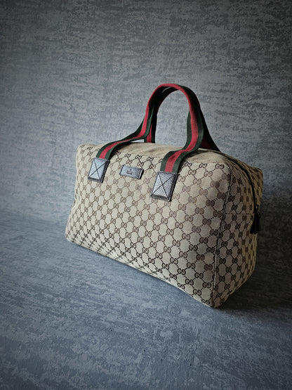 GUCCI GG Leather and webbing-trimmed Supreme Monogram Duffle Bag