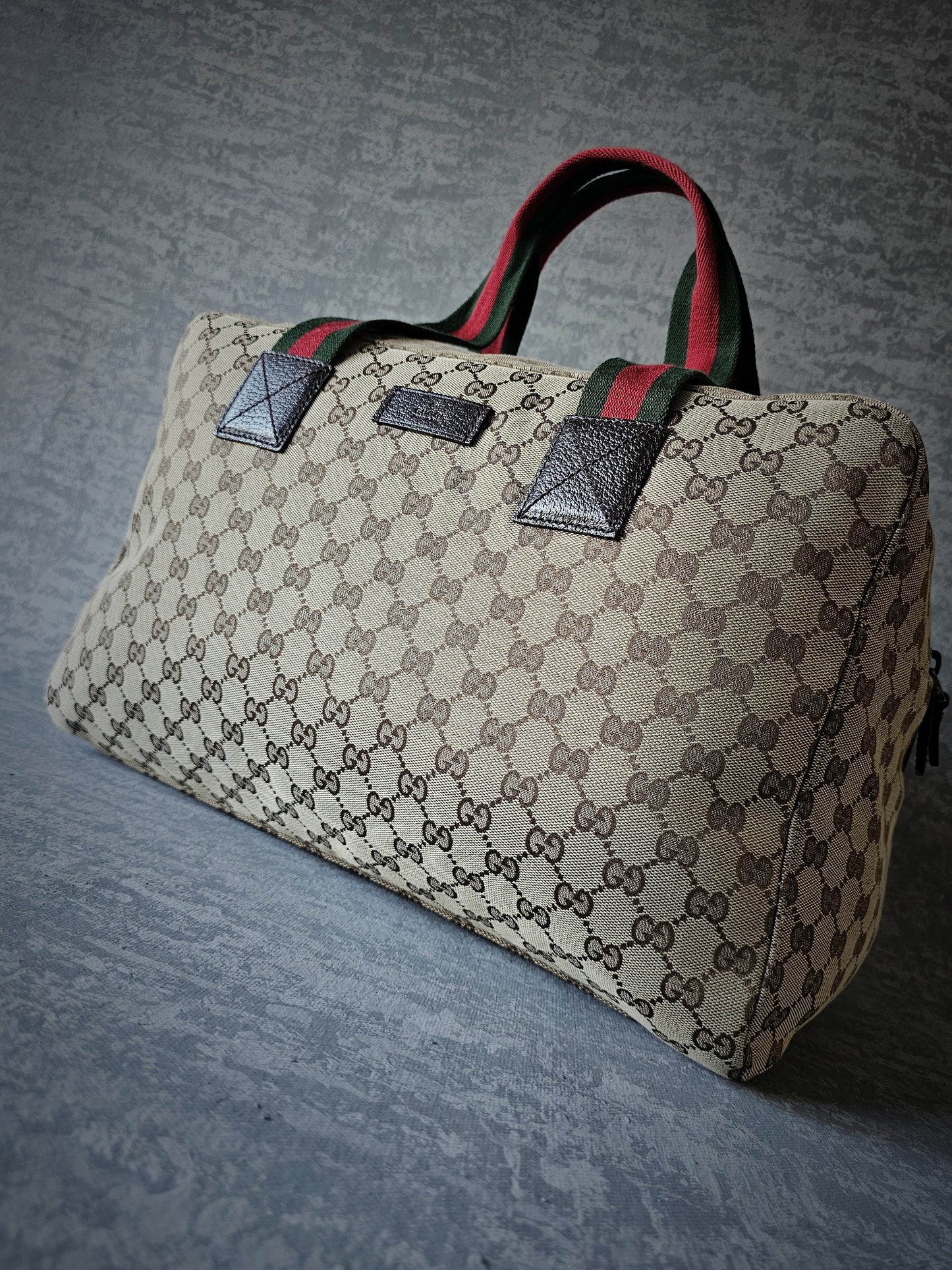 GUCCI GG Leather and webbing-trimmed Supreme Monogram Duffle Bag