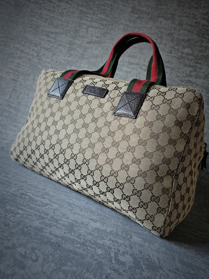 GUCCI GG Leather and webbing-trimmed Supreme Monogram Duffle Bag