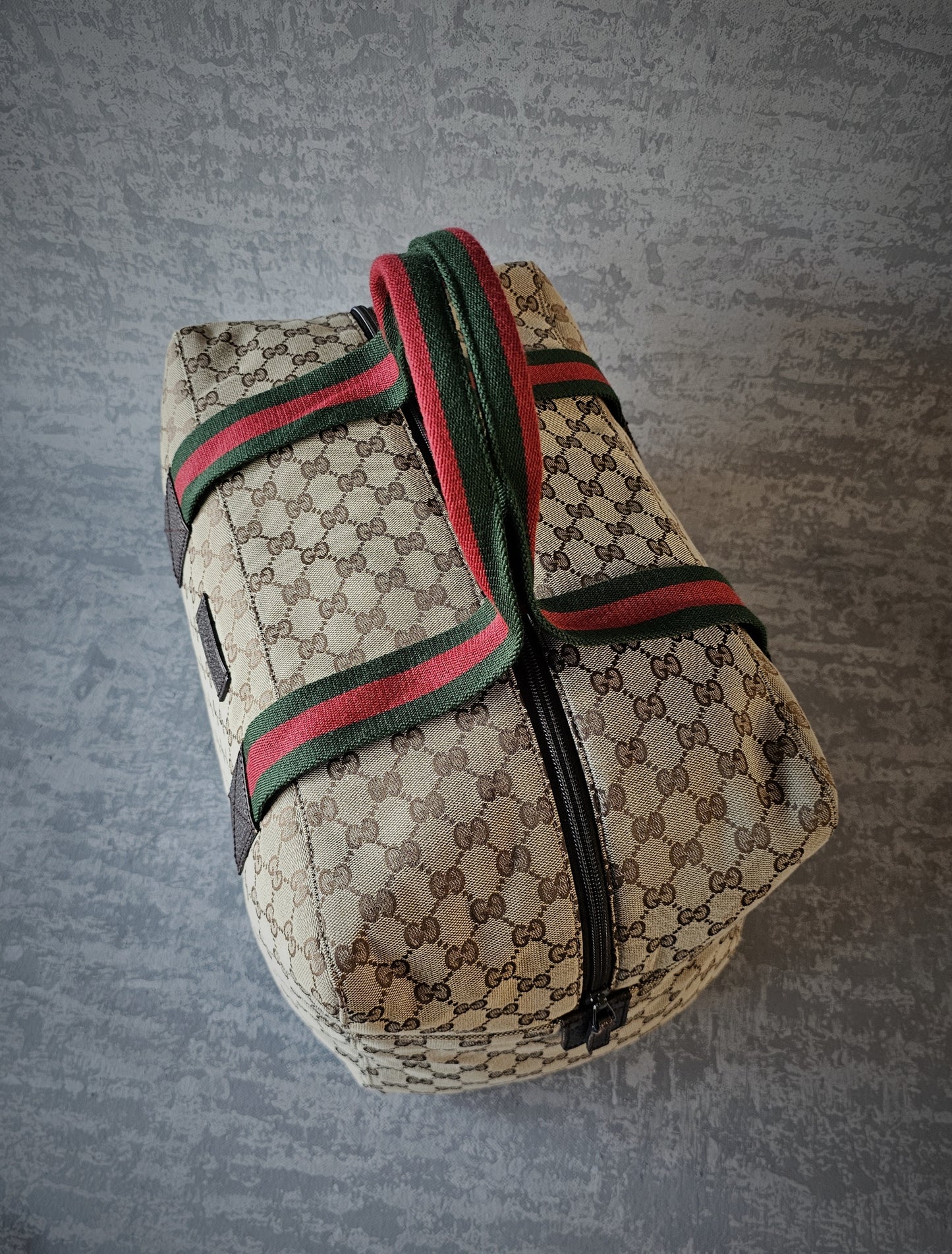 GUCCI GG Leather and webbing-trimmed Supreme Monogram Duffle Bag