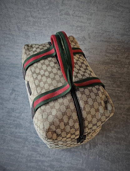 GUCCI GG Leather and webbing-trimmed Supreme Monogram Duffle Bag