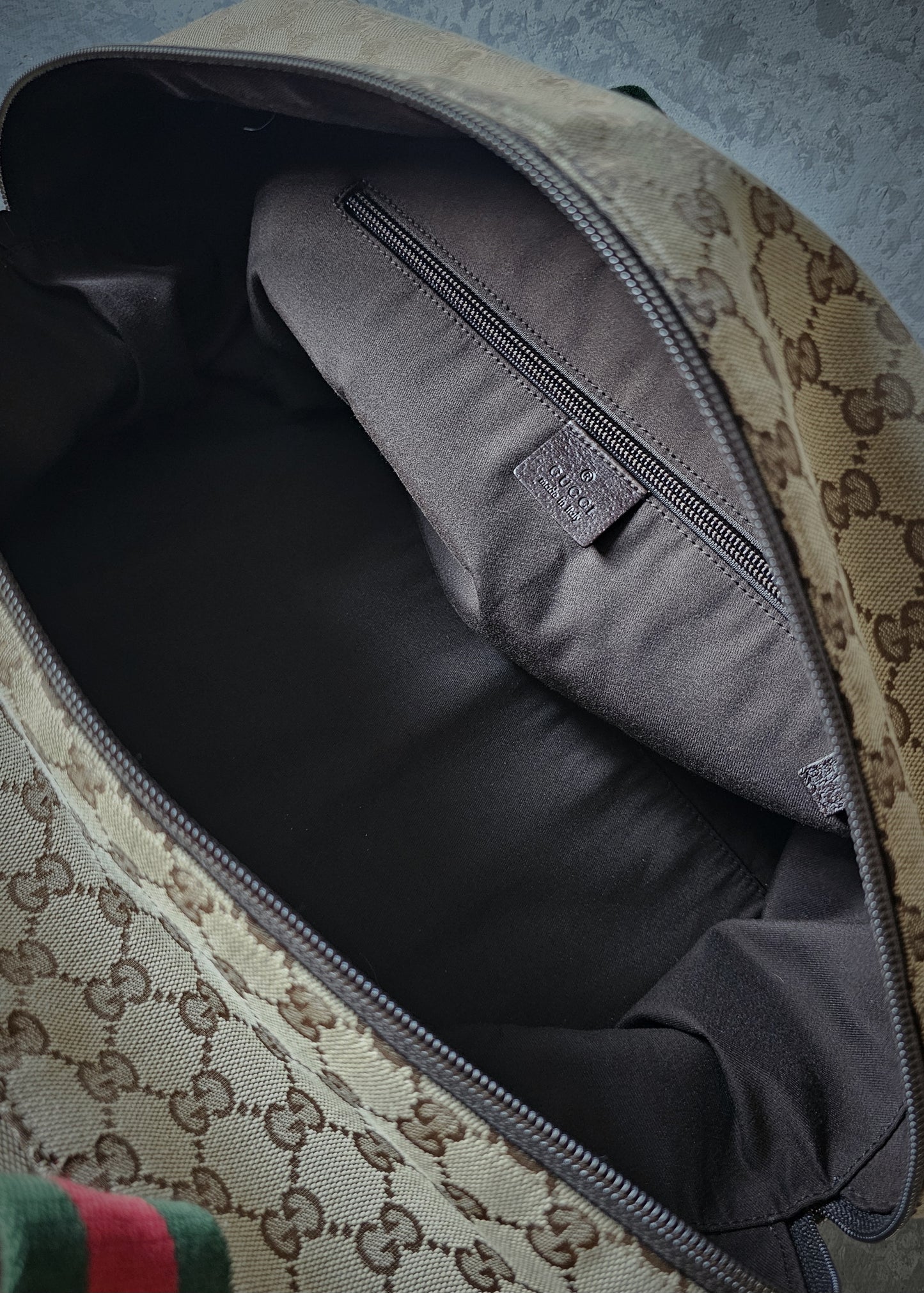 GUCCI GG Leather and webbing-trimmed Supreme Monogram Duffle Bag