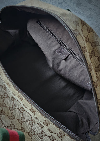 GUCCI GG Leather and webbing-trimmed Supreme Monogram Duffle Bag